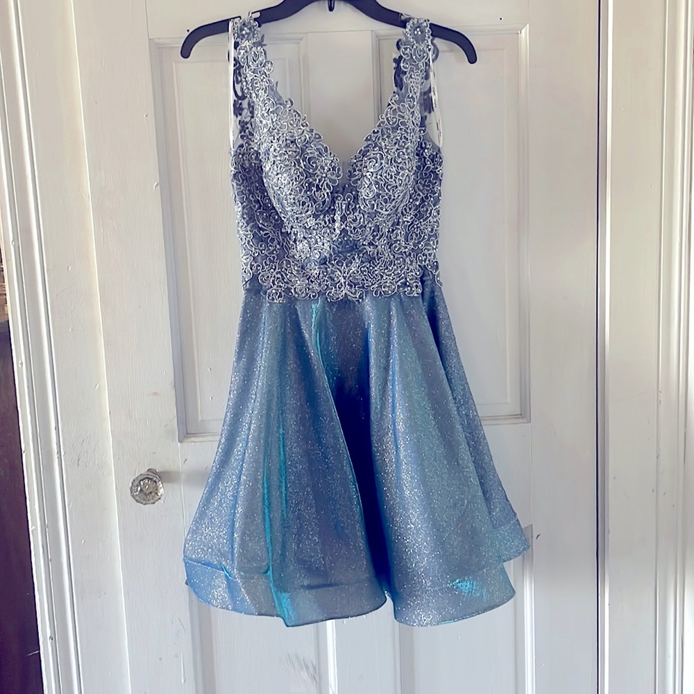 A Juliet dress. Sparkly and slightly holographic. Lace detailing on the top.